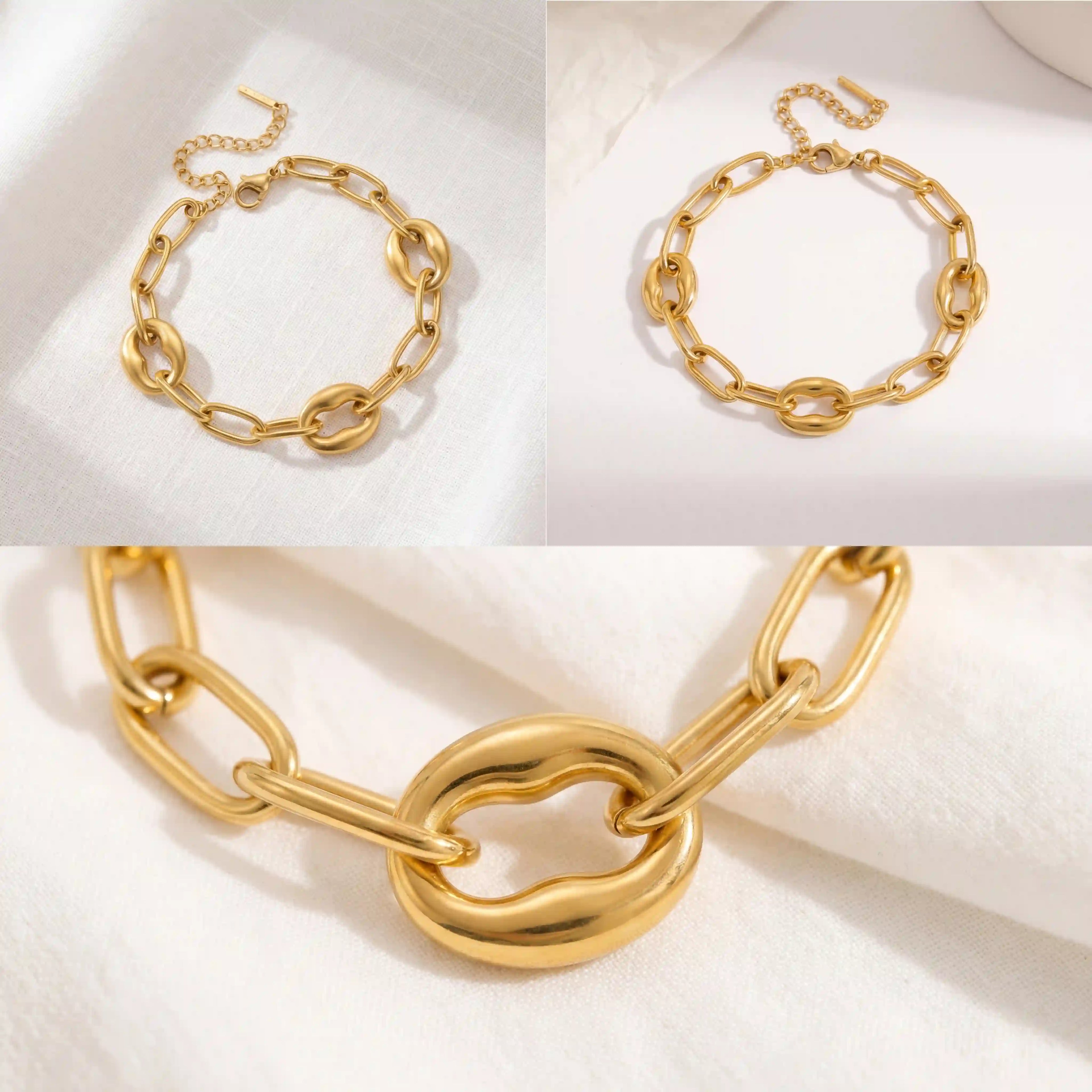 Aesthetic product photography details of thick gold chain bracelet on white silk background.