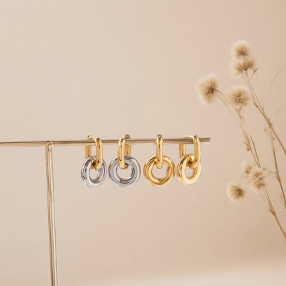 Chunky Twist Knot Hoop Earrings in 18K Gold Plated Brass, isolated on a white gold background.