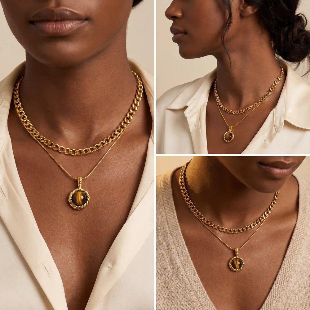 Model with dark skin layering gold tiger's eye necklace with thick gold chain vintage style.