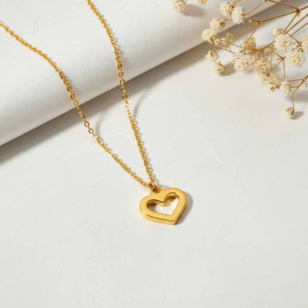 An artistic flat lay of The Devotion Necklace styled with delicate dried flowers, emphasizing its romantic and timeless gift-like quality.