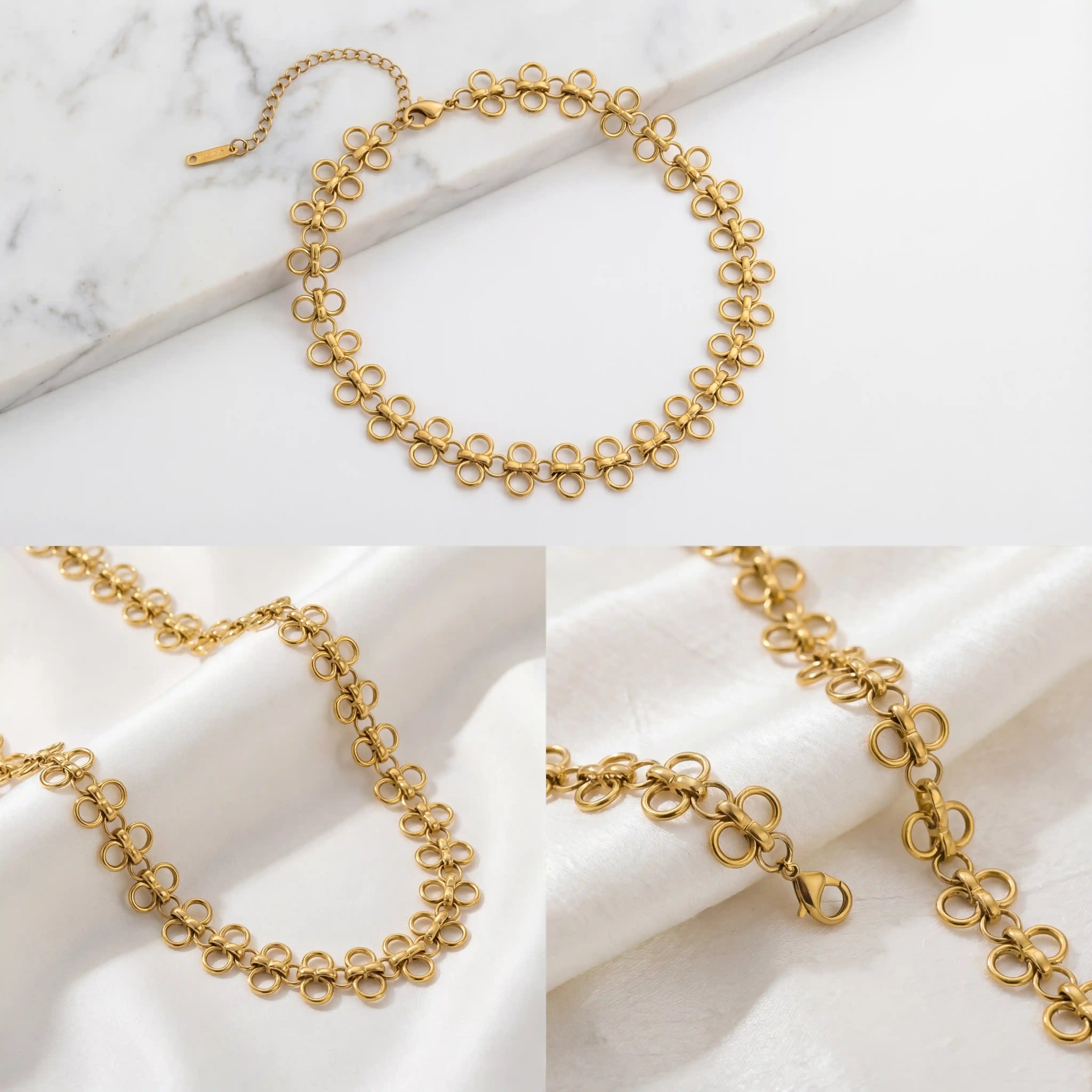 Aesthetic product photography of gold chain choker texture and details on marble.