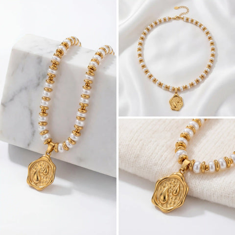 Aesthetic flat lay of heavy gold beaded pearl necklace on marble background.