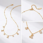 Aesthetic product photography details of gold dewdrop necklace with crystal clusters.
