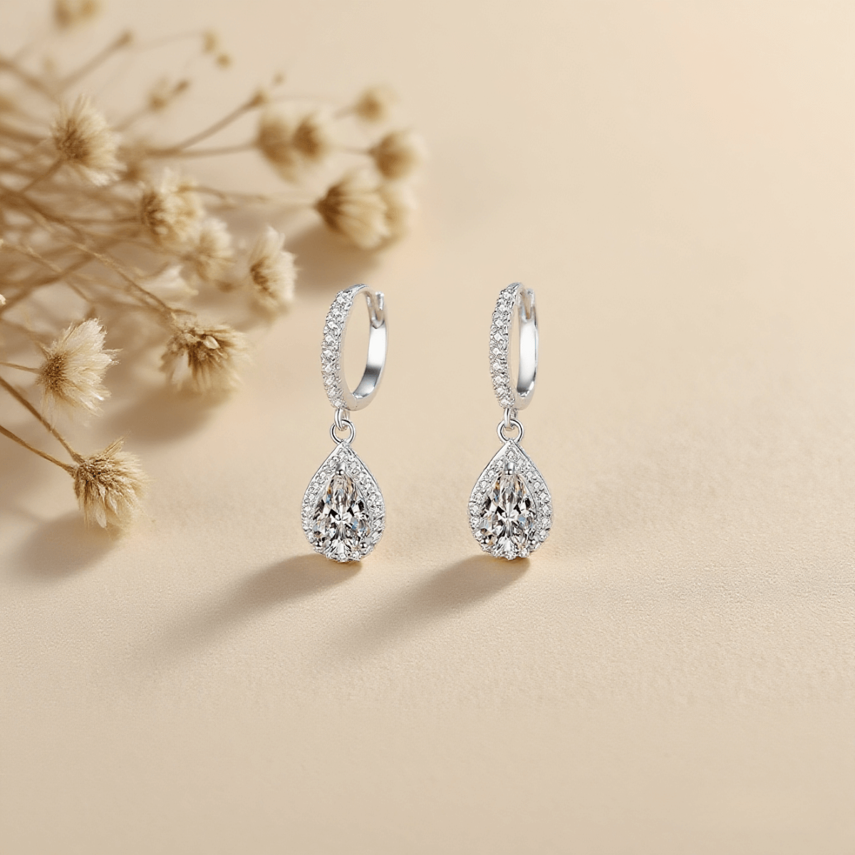 Luminous Drop Moissanite Earrings — teardrop moissanite stud earrings in sterling silver, graceful and radiant.