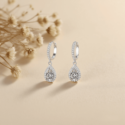 Luminous Drop Moissanite Earrings — teardrop moissanite stud earrings in sterling silver, graceful and radiant.