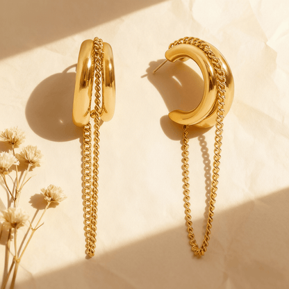 Luxe Layered Chain Hoops in 18K gold featuring a triple-stacked chunky C-shape design with a hanging curb chain on a white background.