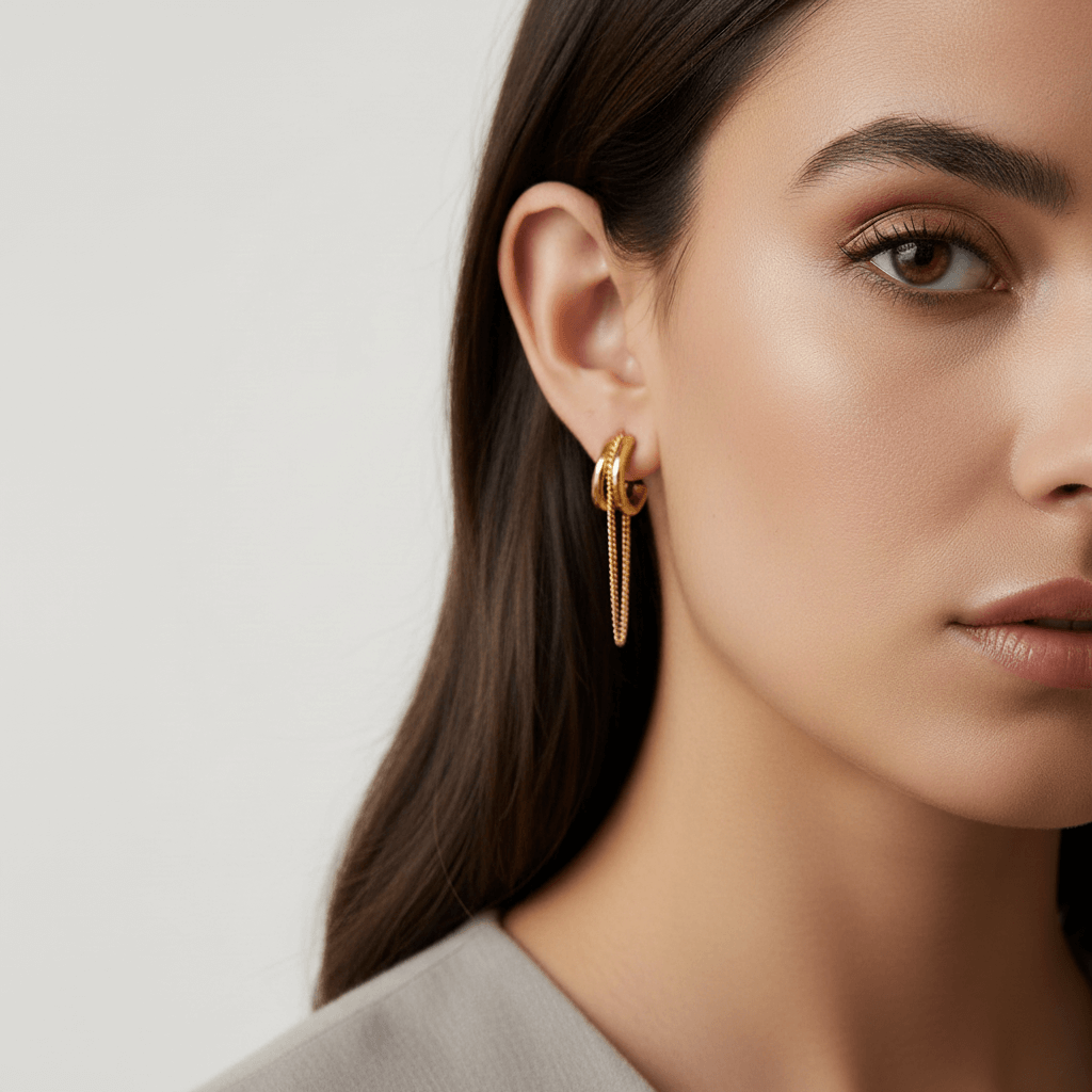 Model wearing the two-tone Luxe Layered Chain Hoops, paired with a black silk blouse to showcase the statement design.