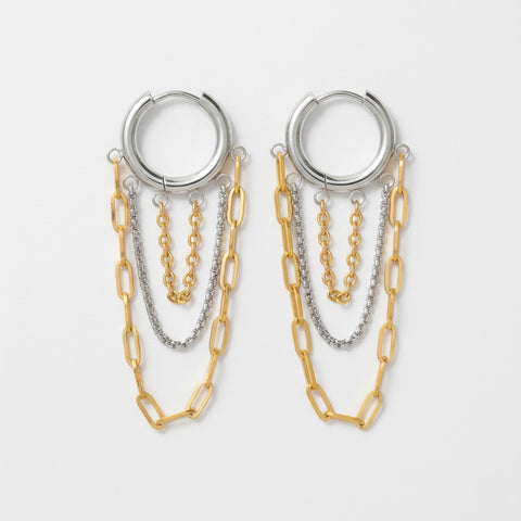 Mixed metal two-tone hoop earrings with silver and gold dangling chains.