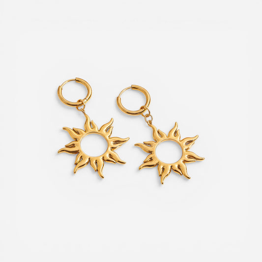 Pair of gold sunburst dangle earrings with huggie hoop waterproof stainless steel.