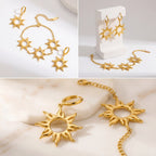 Gold sun jewelry set display including earrings and chain bracelet on stone stand.