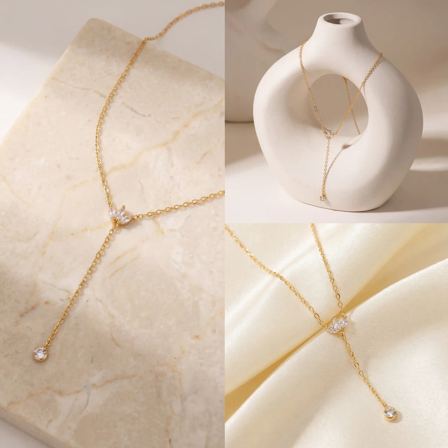 Aesthetic product photography of dainty gold lariat necklace on stone and silk background.