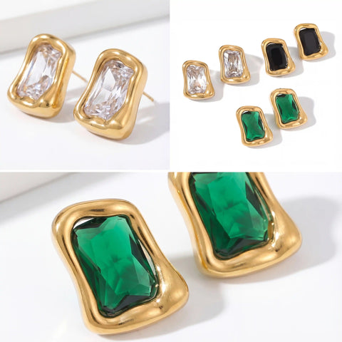 Collection of signet stud earrings in emerald green black onyx and clear crystal.