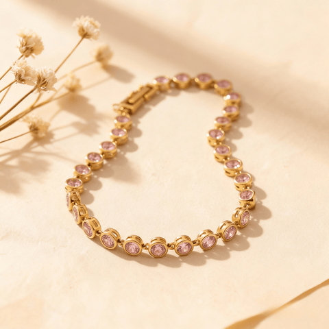 Sweetheart Pink Tennis Bracelet featuring round pink crystals in an 18k gold plated bezel setting, shown on a clean white background.