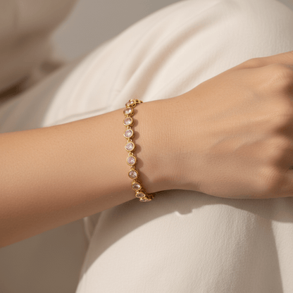 Model wearing the Sweetheart Pink Crystal Tennis Bracelet stacked with a gold watch.