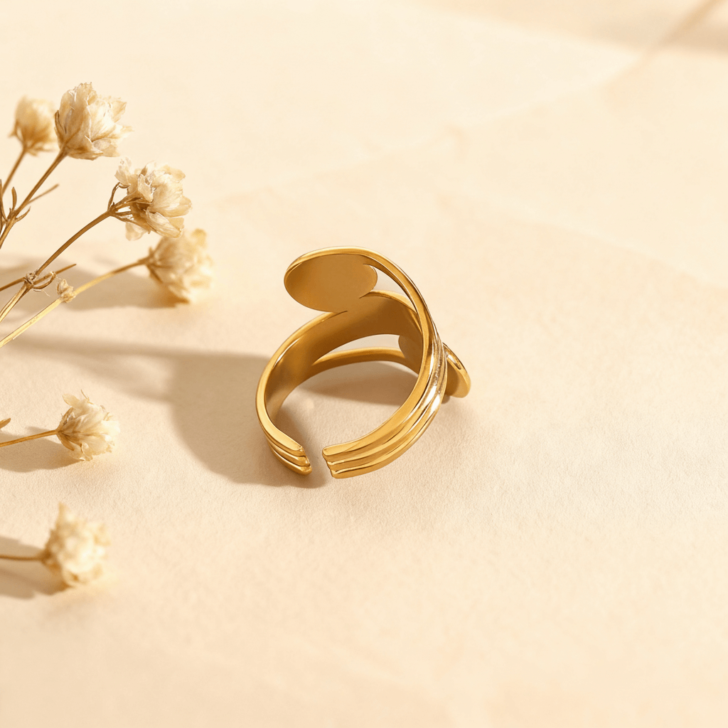 An artistic, high-contrast shot looking through the open space between the spiral and the band of The Oracle Ring. The focus on the negative space emphasizes its bold, open-cuff design and sculptural quality.
