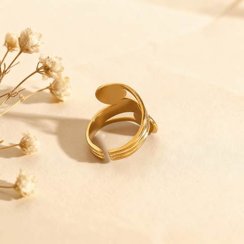 An artistic, high-contrast shot looking through the open space between the spiral and the band of The Oracle Ring. The focus on the negative space emphasizes its bold, open-cuff design and sculptural quality.