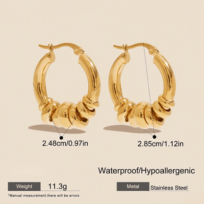 A pair of all-gold Siena Stacked Hoops, highlighting the textural, multi-ring design and high-shine 18K gold finish.