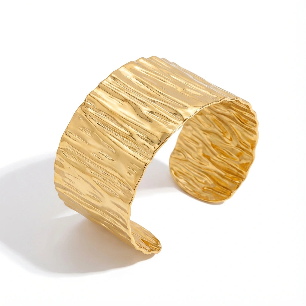 Close up of liquid gold texture open cuff bracelet waterproof jewelry.