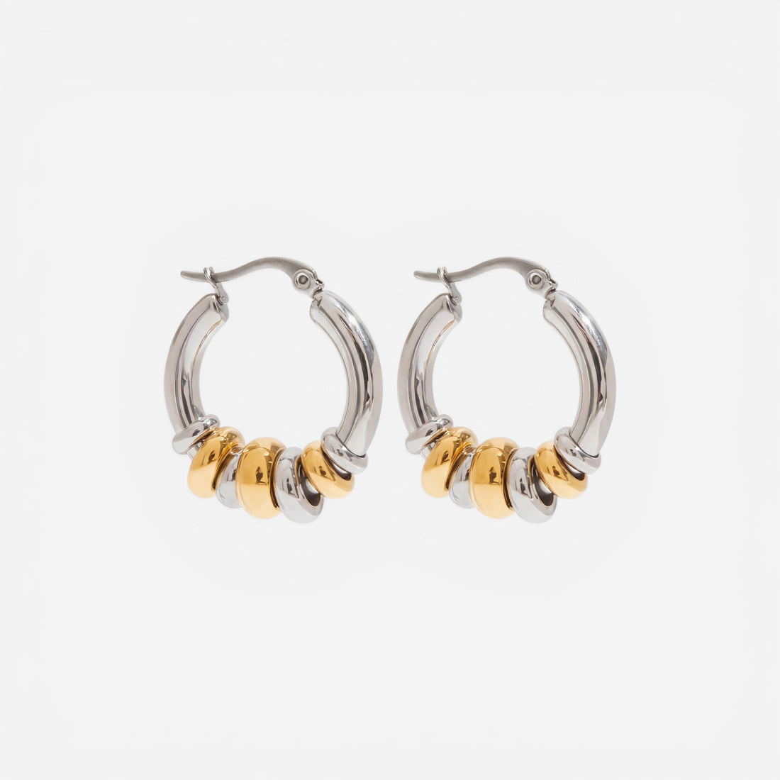 Mixed metal two-tone gold and silver stacked hoop earrings waterproof jewelry.