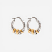Mixed metal two-tone gold and silver stacked hoop earrings waterproof jewelry.