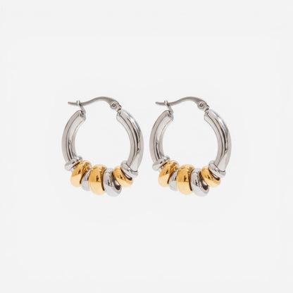 Mixed metal two-tone gold and silver stacked hoop earrings waterproof jewelry.