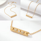 Aesthetic product photography of gold bar necklace details on white background.