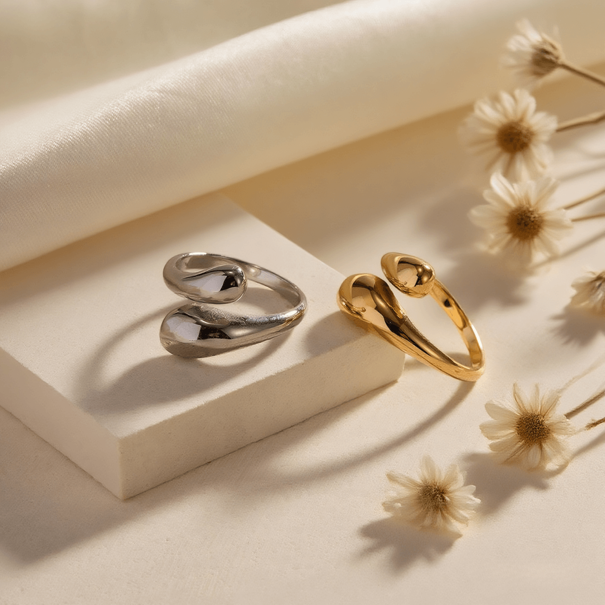 Fluid Pebble Ring — sculptural adjustable pebble wrap ring in gold/silver finish, waterproof and safe for sensitive skin.