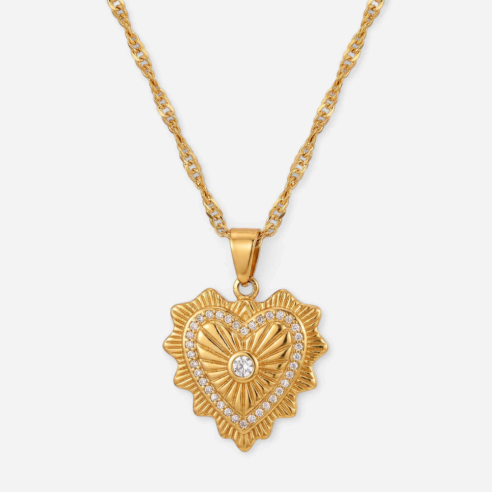 Gold heart shaped pendant necklace with vintage etching and crystal detail waterproof stainless steel.
