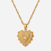 Gold heart shaped pendant necklace with vintage etching and crystal detail waterproof stainless steel.