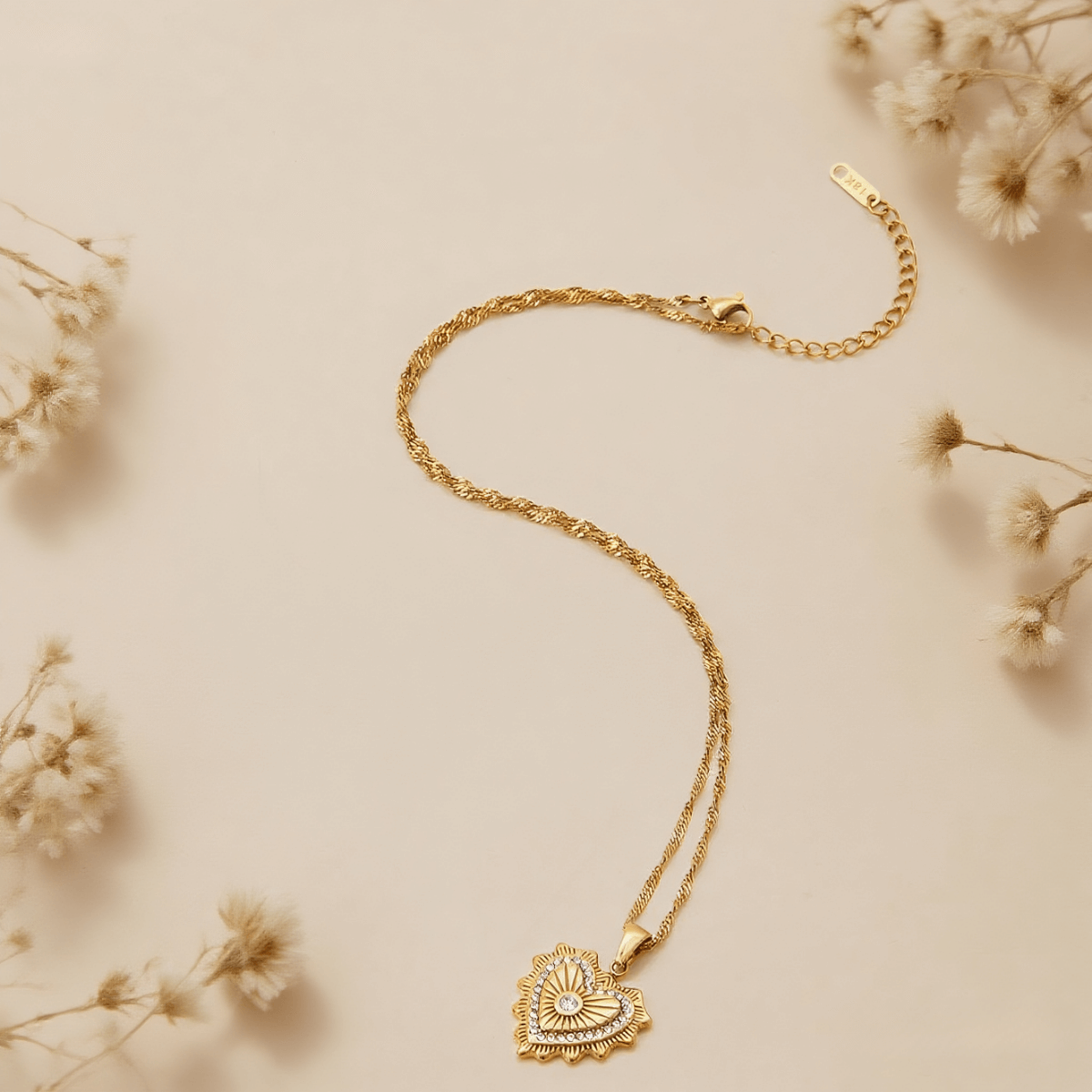 Vintage Heart Medallion Necklace — heart-shaped medallion pendant on twisted gold chain, romantic and vintage style.