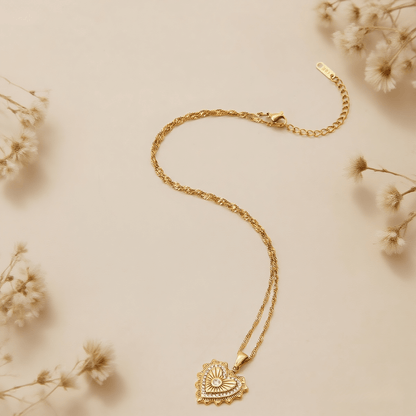 Vintage Heart Medallion Necklace — heart-shaped medallion pendant on twisted gold chain, romantic and vintage style.