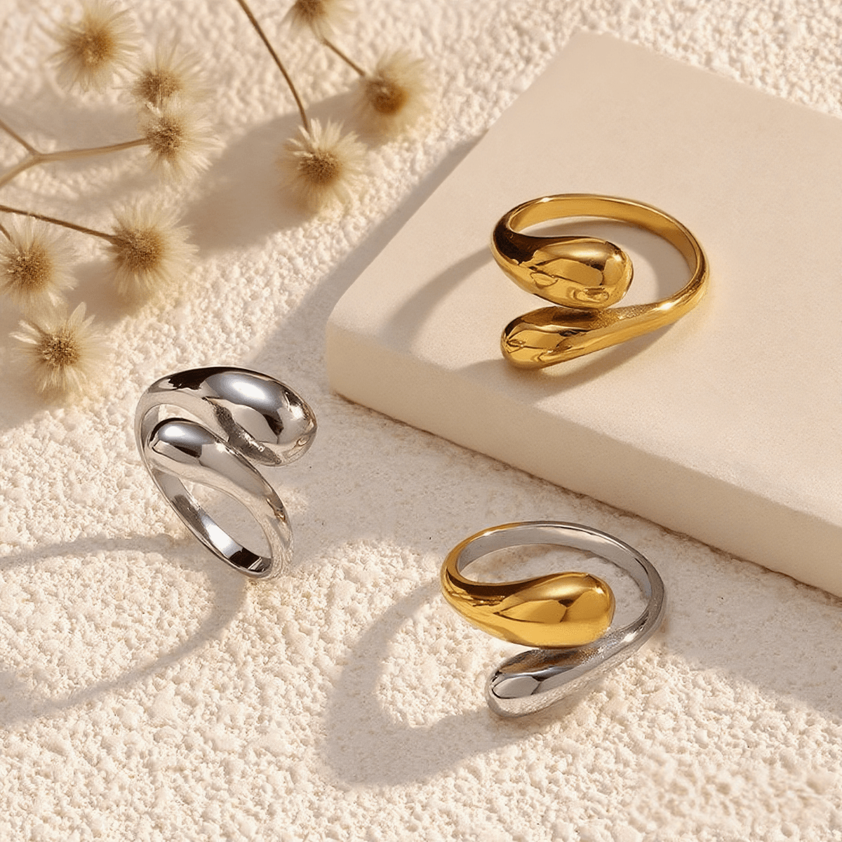 Fluid Pebble Ring — sculptural adjustable pebble wrap ring in gold/silver finish, waterproof and safe for sensitive skin.