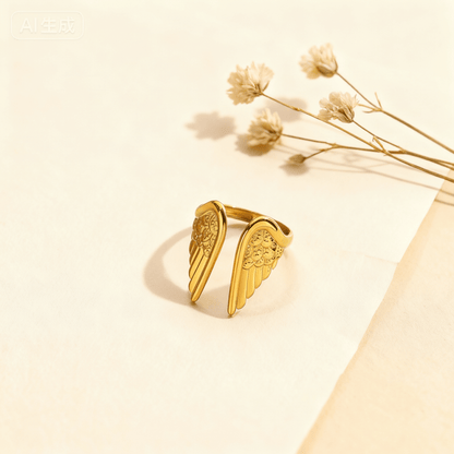 The all-gold version of the Seraphina guardian angel ring, showing the intricate, textured feather details across the entire wing surface.