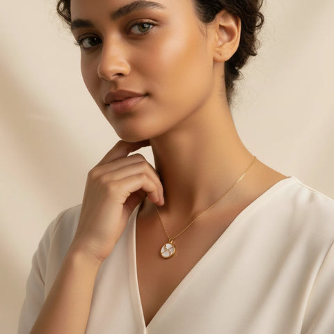 Model wearing white enamel horoscope pendant hypoallergenic stainless steel jewelry.