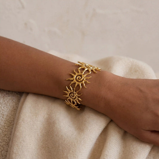 Collage of different angles of adjustable gold sun cuff bracelet waterproof jewelry.