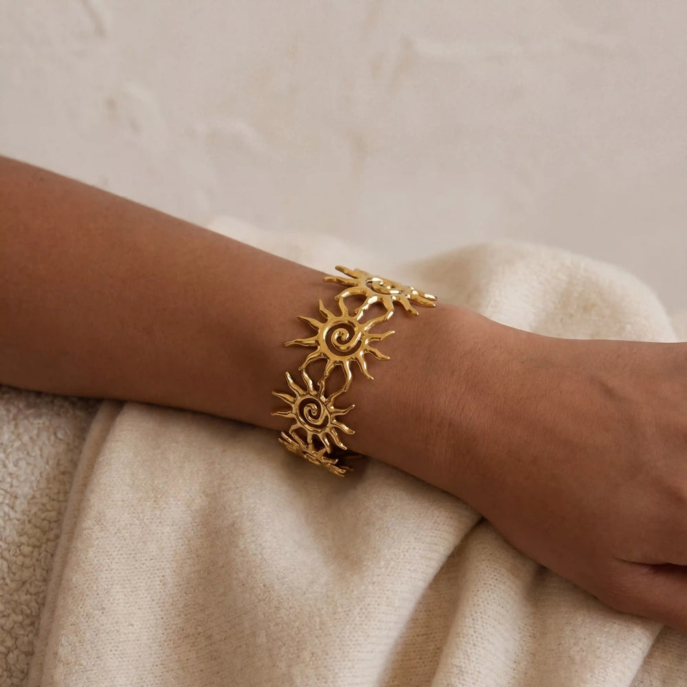 Collage of different angles of adjustable gold sun cuff bracelet waterproof jewelry.