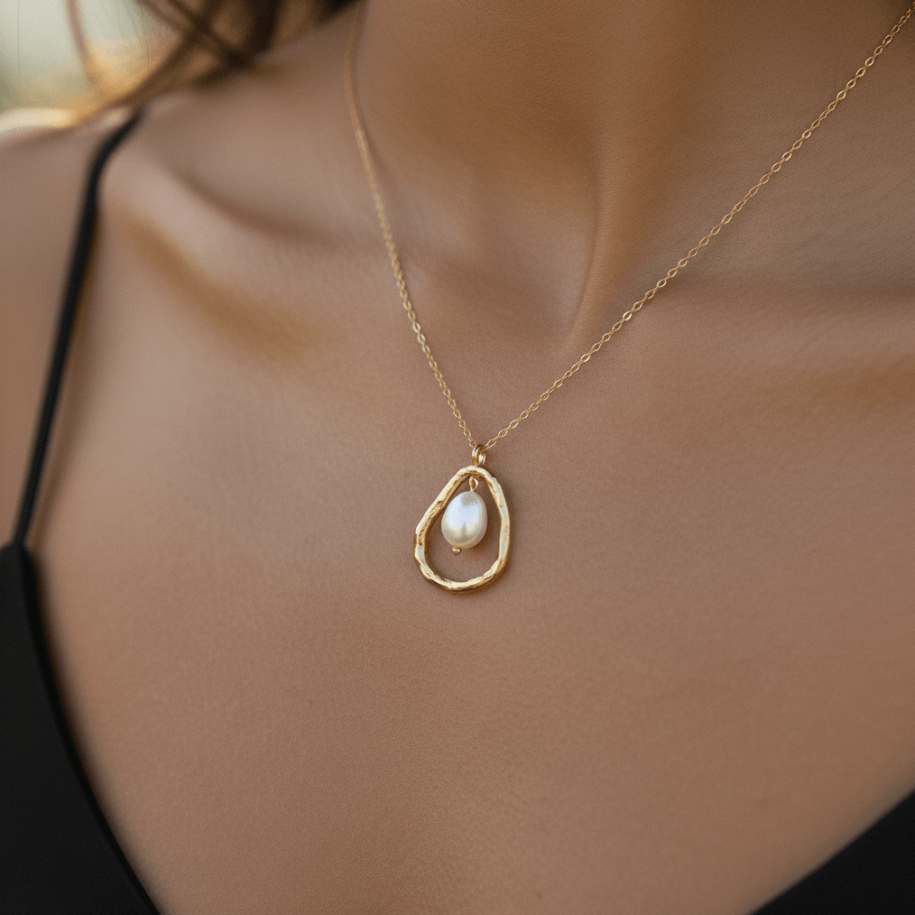 A candid shot of a model on a sunny beach, with wet hair and salty skin. The waterproof Luna Pearl necklace gleams on her chest, proving its durability and status as the perfect, worry-free vacation jewelry.