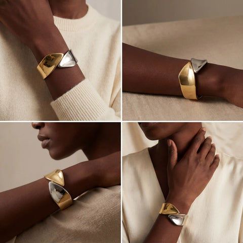 Dark skin model wearing modern mixed metal statement bracelet gold and silver contrast.