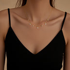 Golden Dew Necklace — delicate gold dew-drop pendant on extender chain, romantic and luminous accessory.