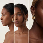 Model with dark skin wearing mixed metal square link earrings modern statement jewelry.