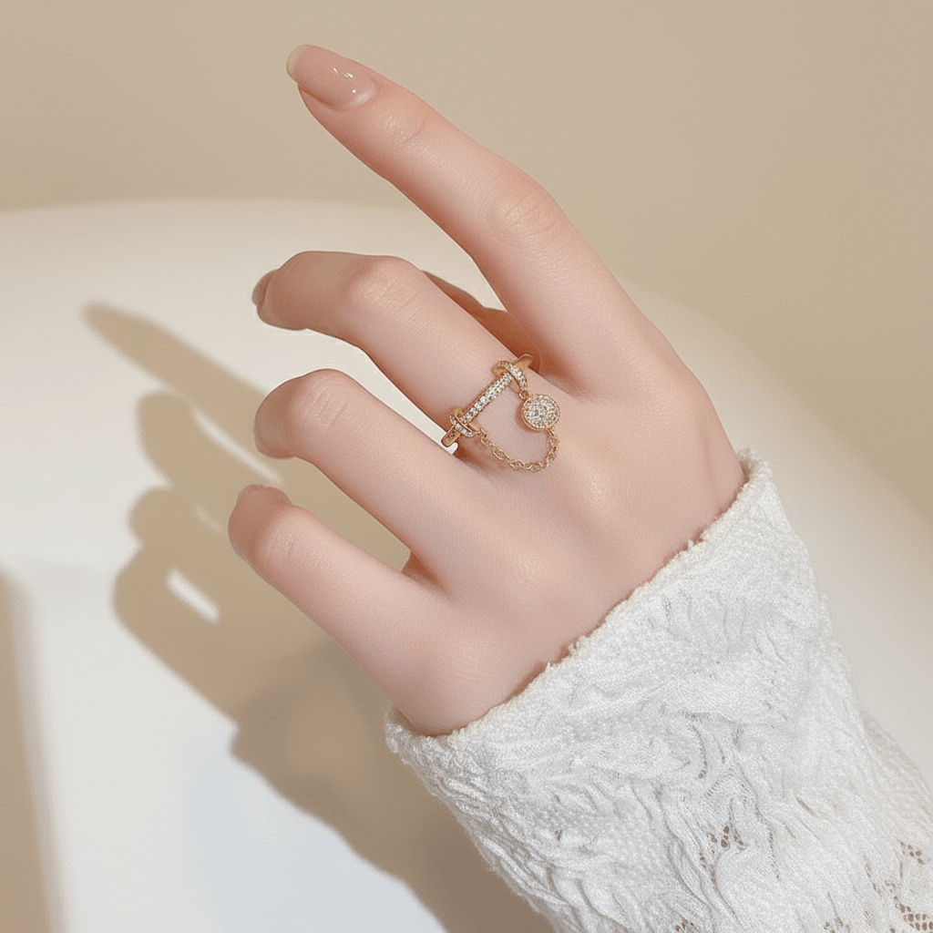 The Comet Ring lying on a vintage star chart or a piece of dark blue paper sprinkled with gold dust. This creative flat-lay directly connects the ring's design to its celestial, astronomical inspiration.