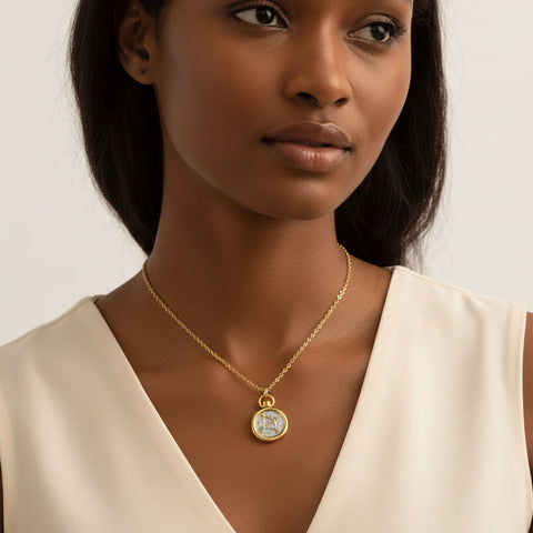 Model wearing vintage style gold and silver zodiac pendant necklace everyday jewelry