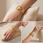 Lifestyle mood board of scallop shell statement bangle styled on woman wrist.