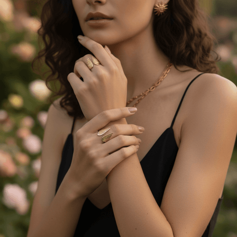 Model wearing the all-gold Seraphina Ring with a simple black top in an outdoor setting, demonstrating the piece's versatile elegance.