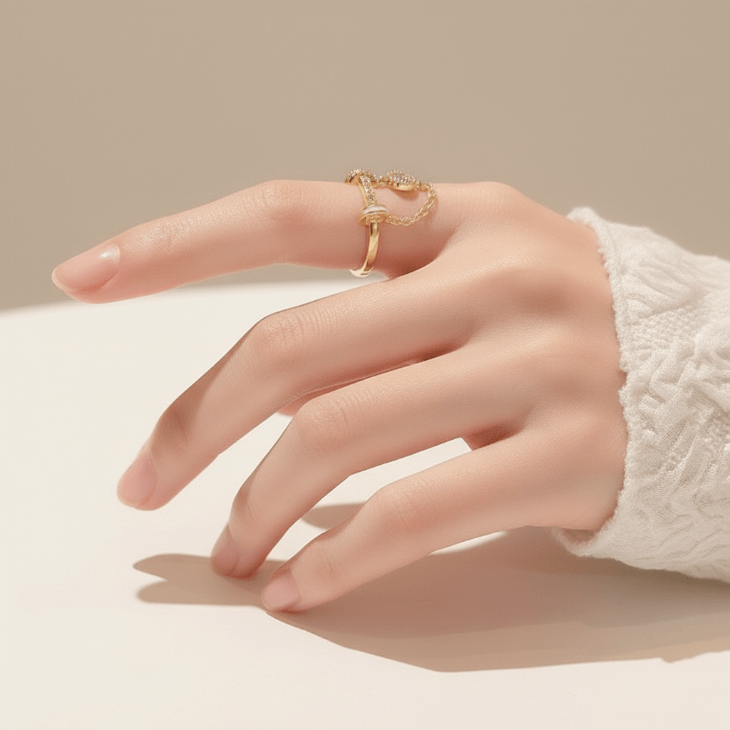 The Comet Ring lying on a vintage star chart or a piece of dark blue paper sprinkled with gold dust. This creative flat-lay directly connects the ring's design to its celestial, astronomical inspiration.